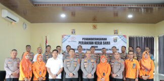 Polres Pringsewu Melakukan Penandatanganan Perjanjian Kerjasama Dengan PT Pos Persero Cabang Utama Bandara Lampung